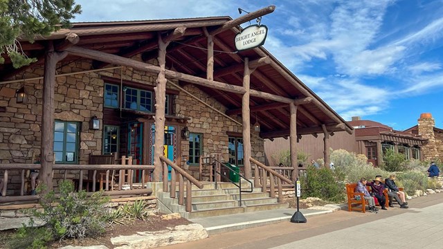 Front entrance to the rustic wood and stone Bright Angel Lodge.