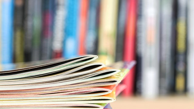 A stack of magazines and publications